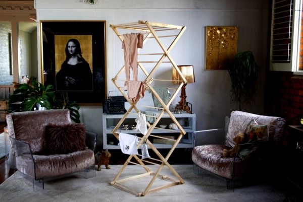 Timber drying rack with baby clothes 3